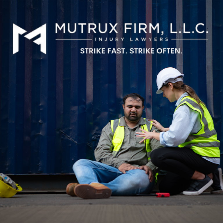 Injured construction worker aided by colleague in safety vests, Mutrux Firm Injury Lawyers logo overlay