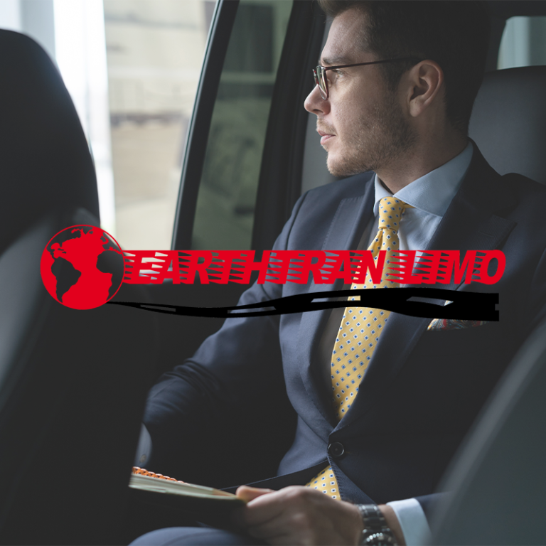 Businessman in suit riding in back seat, looking out window, EarthTran Limo logo overlay