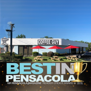 Coffee Guy cafe exterior with red umbrellas and picnic tables, Best in Pensacola choice award graphic below
