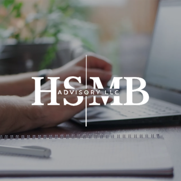 Hands typing on a laptop beside a spiral notebook and pen on a wooden desk, with the HSMB Advisory LLC logo overlay